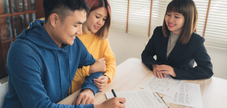 couple negotiating with agent